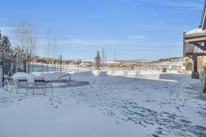 View of yard covered in snow