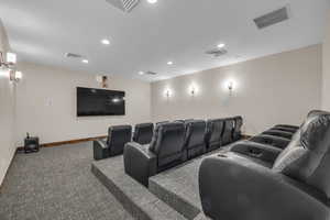 Home theater room featuring carpet floors