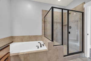 Bathroom with vanity and separate shower and tub