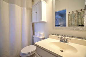 Bathroom with vanity and toilet