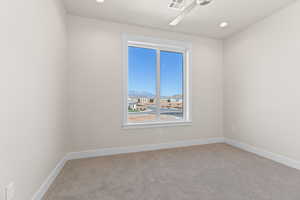 Unfurnished room with light carpet