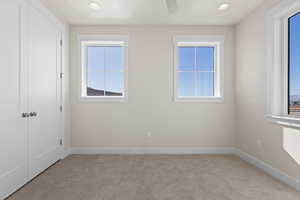 Unfurnished room with light carpet