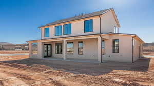 Rear view of property featuring a patio