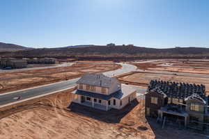 Birds eye view of property with a mountain view