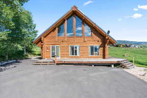 View of side of home featuring a mountain view