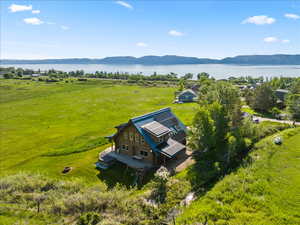 Drone / aerial view with a rural view and a water and mountain view