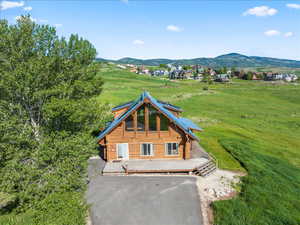 Exterior space featuring a deck with mountain view