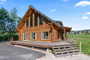 Rear view of house with a deck