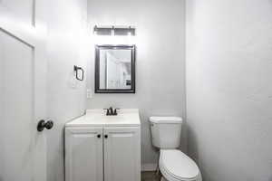 Bathroom with vanity and toilet