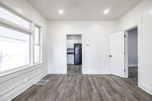 Spare room featuring hardwood / wood-style flooring