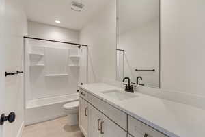 Basement Full bathroom featuring vanity, tile flooring,  shower combination, and toilet