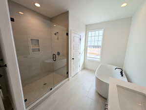 Primary Bathroom featuring walk in shower