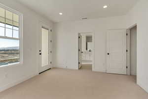 Primary bedroom with balcony