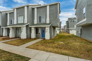 View of front of house with a front yard