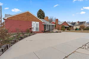 View of front of property featuring a sunroom