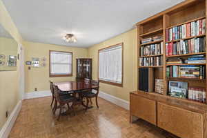 Dining space with parquet flooring