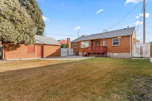 Back of house featuring a yard and a patio area