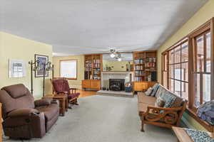 Living room featuring a wealth of natural light and a textured ceiling