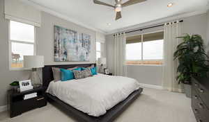 Bedroom with ceiling fan, light colored carpet, and ornamental molding