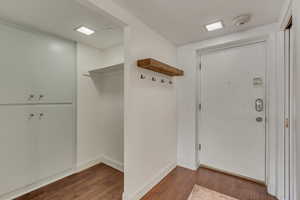 Mudroom with dark wood-type flooring