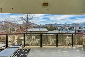 View of patio / terrace featuring a mountain view and a balcony