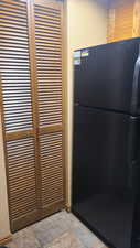 Room details with black refrigerator