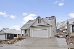 View of front of property featuring a porch and a mountain view