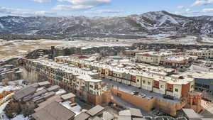 Snowy aerial view with a mountain view