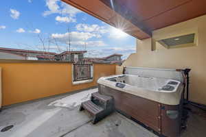 View of patio / terrace with a hot tub