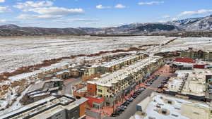 Snowy aerial view featuring a mountain view