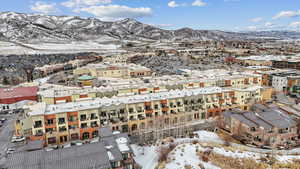 Snowy aerial view featuring a mountain view