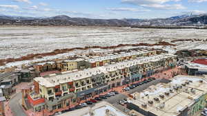 Snowy aerial view featuring a mountain view