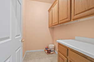 Washroom with light tile patterned floors