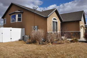 View of home's exterior featuring central AC