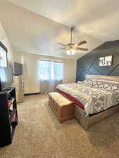 Master Bedroom featuring lofted ceiling, ceiling fan, and a textured ceiling
