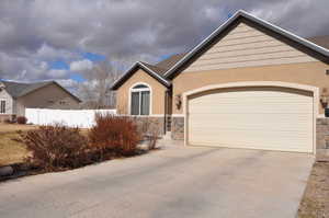 View of front facade featuring a garage
