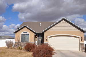 View of front facade featuring a garage