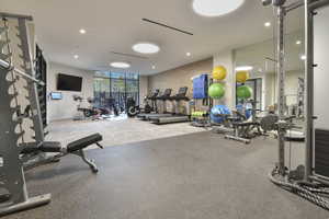 Exercise room featuring expansive windows