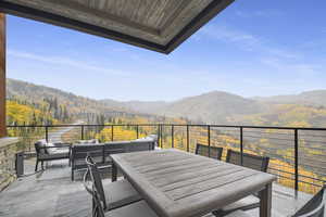 Balcony featuring a mountain view and an outdoor living space