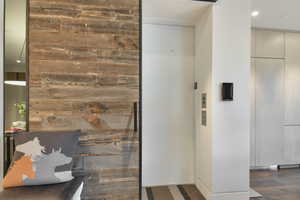 Interior space featuring wood-type flooring and elevator