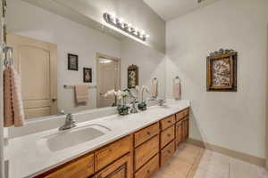 Bathroom featuring vanity and tile patterned floors