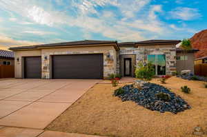 Prairie-style home with a garage