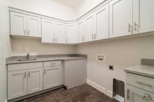 Laundry room with gas dryer hookup, sink, cabinets, hookup for a washing machine, and electric dryer hookup