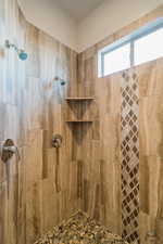 Bathroom featuring tiled shower