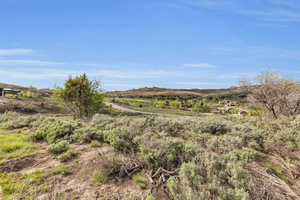 Property view of mountains with a rural view