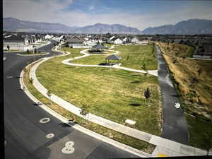 Surrounding community featuring a gazebo, a mountain view, and a yard