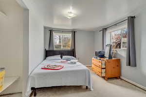 Bedroom featuring concrete flooring