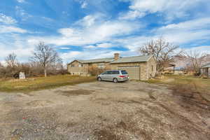 View of front of house featuring a garage and a front yard