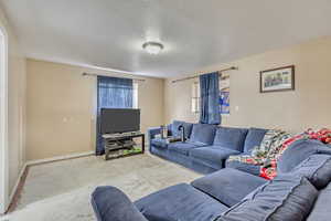 Living room featuring a textured ceiling