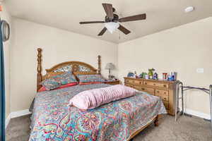 Bedroom featuring carpet flooring and ceiling fan